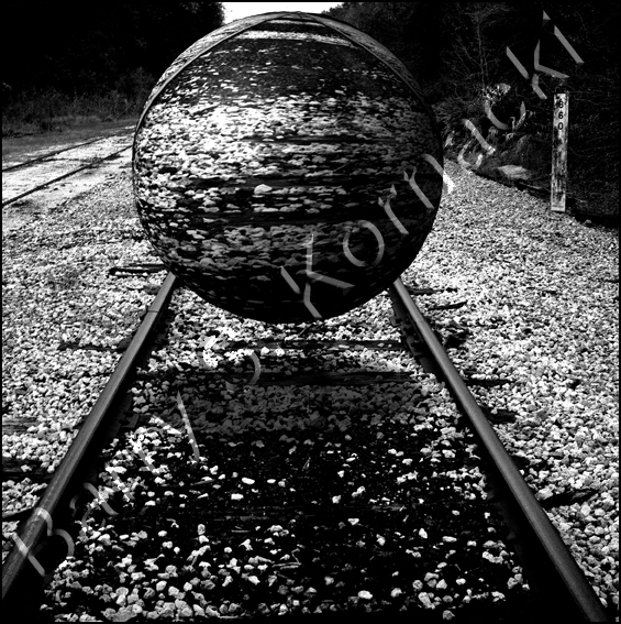 Tracks with ball, black and white photograph